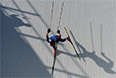 Максим Вылегжанин (Россия) на дистанции эстафеты в соревнованиях по лыжным гонкам среди мужчин на XXII зимних Олимпийских играх в Сочи.