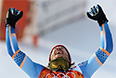 Хьетиль Янсруд (Норвегия), завоевавший золотую медаль в слаломе-супергиганте среди мужчин во время соревнований по горнолыжному спорту на XXII зимних Олимпийских играх в Сочи, во время цветочной церемонии.