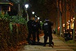 Парижские полицейские проверяют мужчину возле клуба "Батаклан", где в пятницу вечером произошел захват заложников.