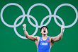 Китайский спортсмен Люй Сяоцзюнь (до 63 кг) поднял штангу в рывке весом 177 кг